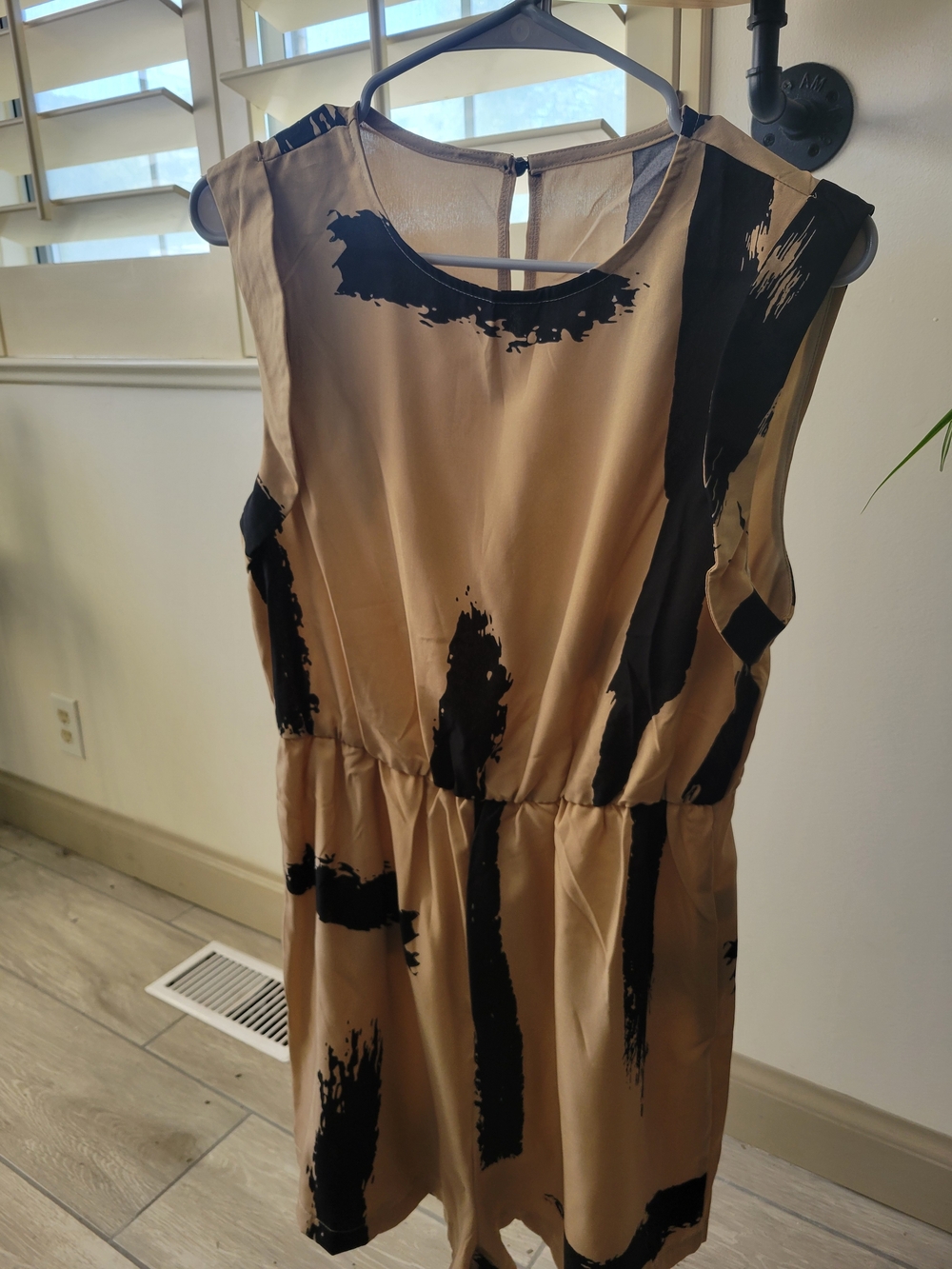 Sleeveless Beige Romper with Black Brushstroke Print